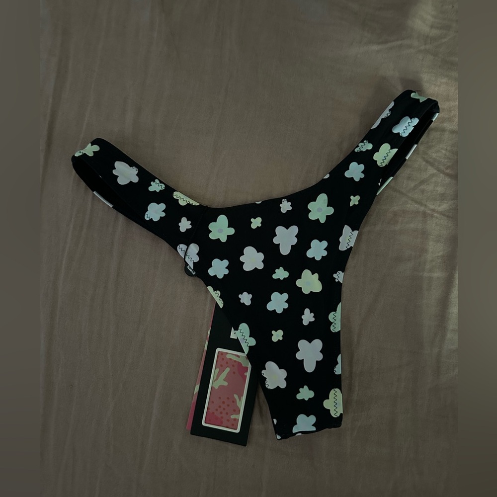 Blackbough Swim x Frasier Sterling thong bikini bottom in Oopsie Daisy pattern